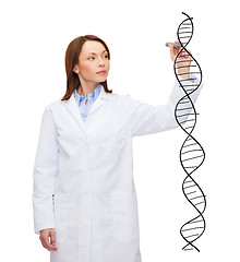 Image showing young female doctor writing dna molecule