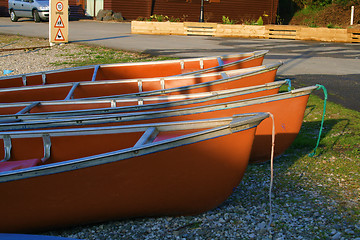 Image showing canoes in the morning light