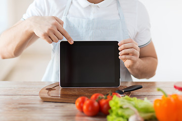 Image showing close up of male hands holding tablet pc