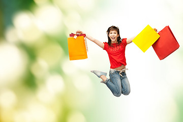 Image showing excited girl with shopping bags