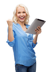 Image showing happy young woman with tablet pc computer