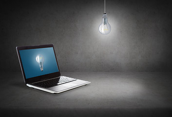 Image showing laptop computer with light bulb on screen