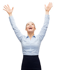 Image showing laughing businesswoman waving hands