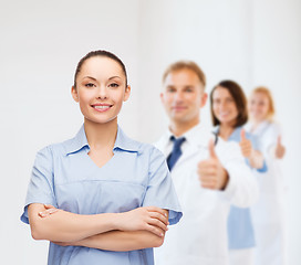 Image showing smiling female doctor or nurse