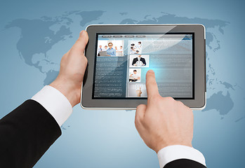 Image showing close up of man hands touching tablet pc