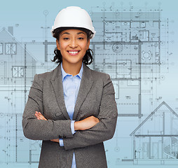 Image showing businesswoman in white helmet with crossed arms