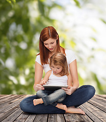 Image showing happy mother with little girl and tablet pc