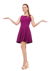 Image showing young woman in purple dress and high heels