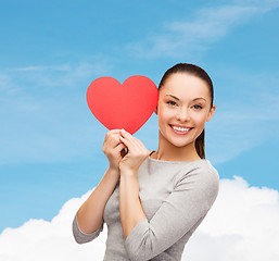 Image showing smiling asian woman with red heart