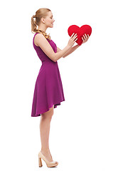 Image showing young woman in purple dress and high heels