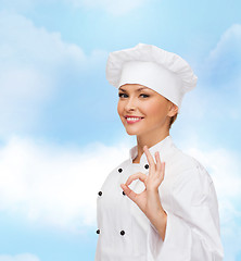 Image showing smiling female chef showing ok hand sign