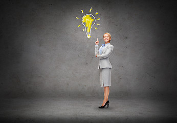 Image showing attractive young businesswoman with her finger up