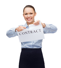 Image showing serious businesswoman tearing contract