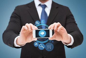 Image showing businessman showing smartphone with blank screen