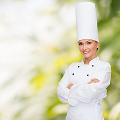 Image showing smiling female chef with crossed arms