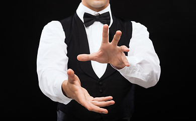 Image showing casino dealer showing trick