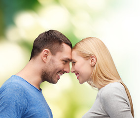 Image showing smiling couple looking at each other