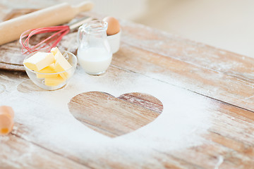 Image showing close up of heart of flour on wooden table at home