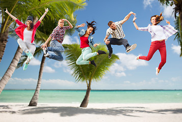 Image showing group of teenagers jumping