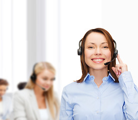 Image showing friendly female helpline operator at office