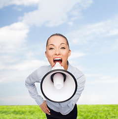 Image showing screaming businesswoman with megaphone