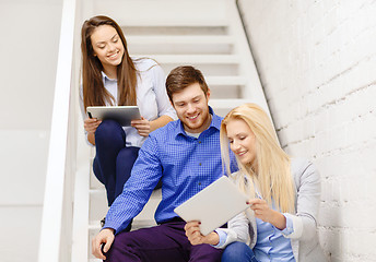 Image showing team with tablet pc computer sitting on staircase