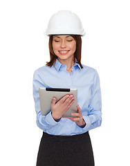 Image showing young smiling businesswoman in white helmet