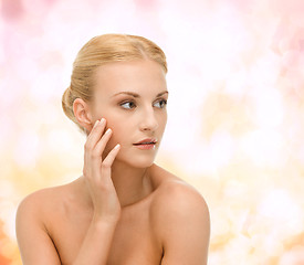 Image showing beautiful woman touching her face skin