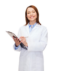 Image showing smiling female doctor with clipboard