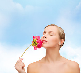 Image showing lovely woman with peonie flower