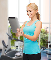 Image showing sporty woman with tablet pc