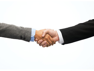 Image showing businessman and businesswoman shaking hands