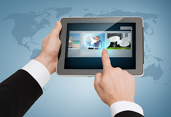 Image showing close up of man hands touching tablet pc