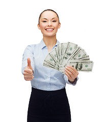 Image showing young businesswoman with dollar cash money