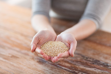 Image showing cloes uo of female cupped hands with quinoa