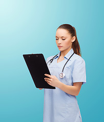 Image showing serious female doctor or nurse with stethoscope