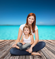 Image showing happy mother with adorable little girl