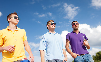 Image showing group of male friends with bottles of beer