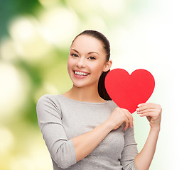 Image showing smiling asian woman with red heart