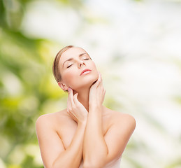 Image showing beautiful woman touching her face with closed eyes