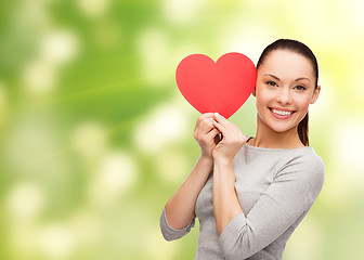 Image showing smiling asian woman with red heart