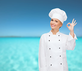 Image showing smiling female chef showing ok hand sign