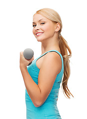 Image showing young sporty woman with light dumbbells