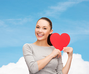 Image showing smiling asian woman with red heart