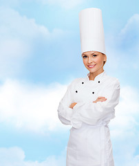 Image showing smiling female chef with crossed arms