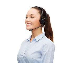 Image showing friendly female helpline operator with headphones