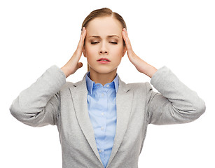 Image showing stressed businesswoman having headache
