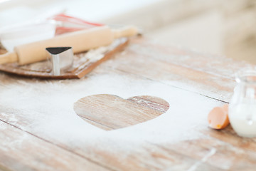 Image showing close up of heart of flour on wooden table at home