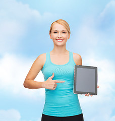 Image showing sporty woman with tablet pc blank screen