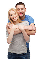 Image showing smiling couple hugging